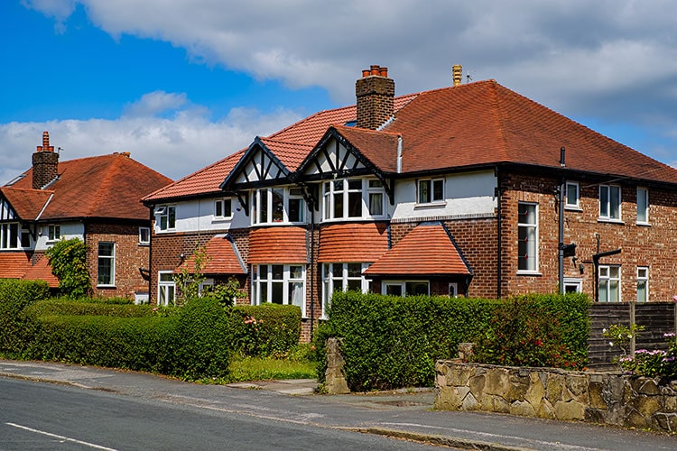 An image of modern UK homes on a street.